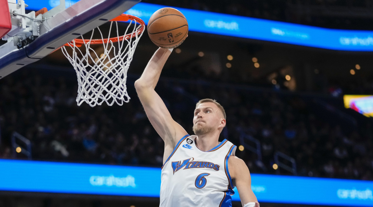 Wizards center Kristaps Porzingis goes up for a dunk during the first half vs. the Hawks.